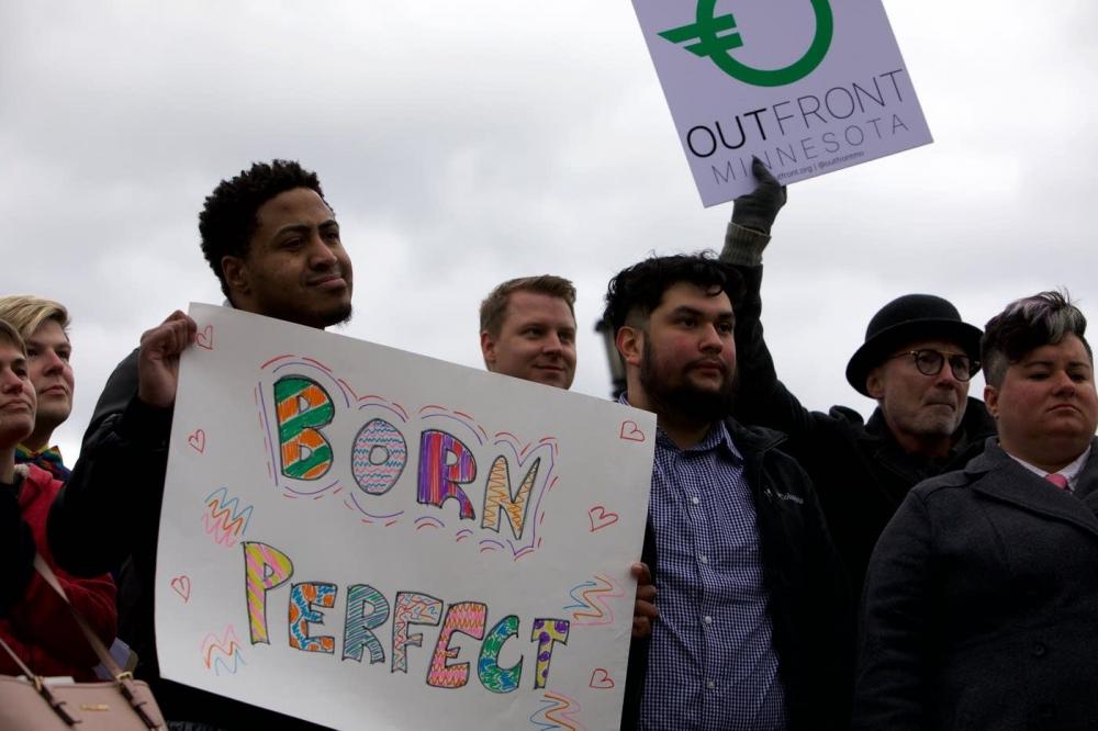 A crowd gathers during a press conference about the joint launch of proposed municipal ordinances in Minneapolis and St. Paul restricting the practice known as conversion therapy on Friday, Oct. 11, 2019.