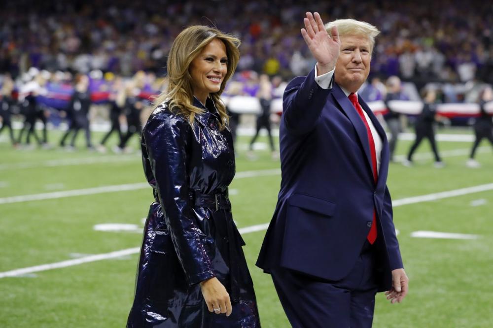 President Donald and Melania Trump attended the January 13th College Football Playoff National Championship game between Clemson and Louisiana State Universities, where a Teacher of the Year kneeled during the National Anthem. (Photo by Kevin C. Cox/Getty Images)