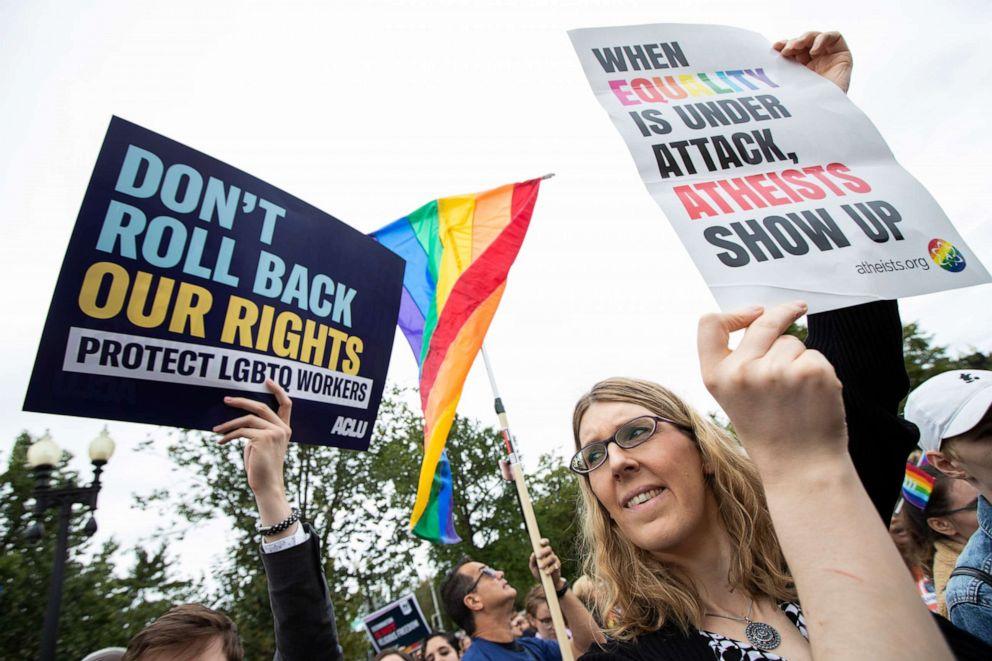 Transgender woman Alison Gill from Maryland, joins LGBT supporters in front of the U.S. Supreme Court, Tuesday, Oct. 8, 2019, in Washington.